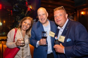 Guests celebrating with drinks at FundBank's launch event.